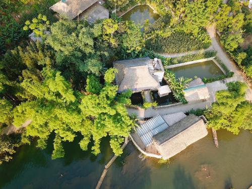 an aerial view of a house in the water at Jack Ecolodge in Lung Co (1)