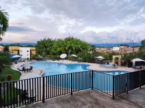 a view of a swimming pool in a resort at Apartasol confortable cerca al parque del café! in La Tebaida