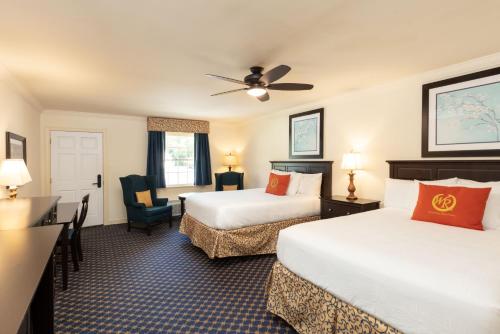 a hotel room with two beds and a desk at Westgate Historic Williamsburg Resort in Williamsburg
