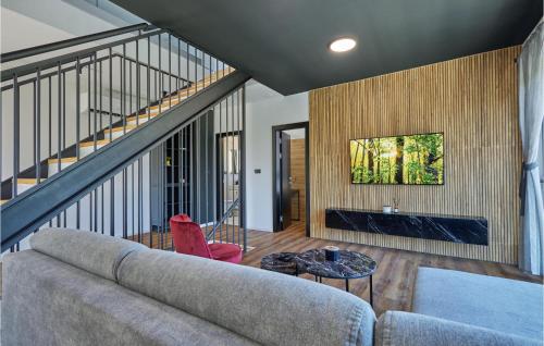 a living room with a couch and a fireplace at Lovely Home In Bedenica With Jacuzzi in Bedenica