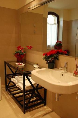 a bathroom with a sink and a mirror at OLATZEA LANDA HOTELA in Arbizu