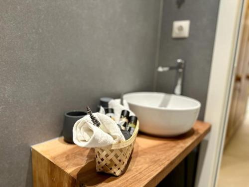 a bathroom with a sink and a bowl on a counter at Milva by Goutos Luxury Living in Agios Aimillianos