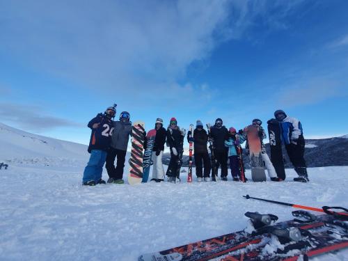 a group of people standing in the snow at Tiny & Big House Suite Los Mallines de Malalcahuello in Malalcahuello
