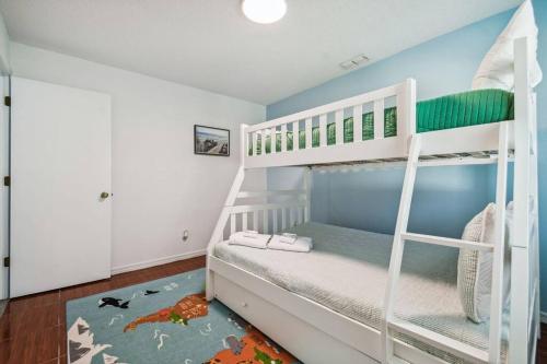 a childs bedroom with bunk beds in it at TRANQUILITY! PRIVATE Gated Estate! Boats, RVs OK! Has Separate Apt, Fishing, Hiking, LOW Rates! in Kissimmee