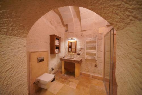 a bathroom with a toilet and a sink at Fairyland Cave Hotel in Goreme