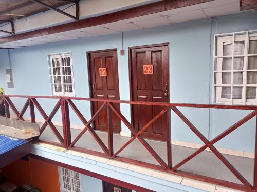 a pair of doors on the side of a building at Surfari Bocas in Bocas del Toro