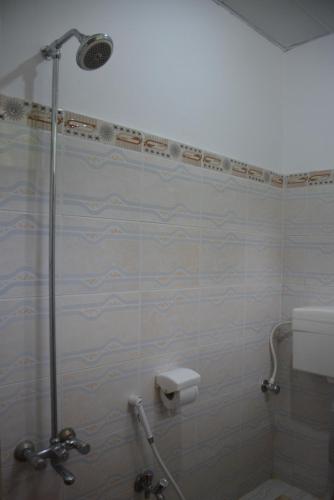 a bathroom with a shower with a toilet and a sink at Eagle Nest, Malam Jabba by LMC in Swat