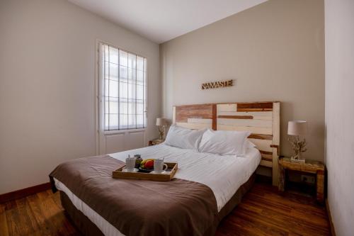 Postel nebo postele na pokoji v ubytování Appart'hotel Perle de Ré