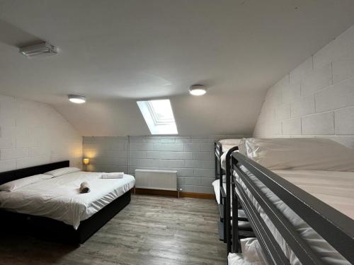 a bedroom with two bunk beds and a window at Achill Surf Centre in Mayo