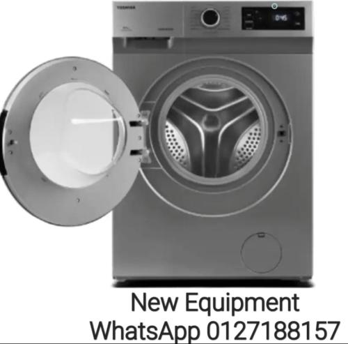 a washing machine with the words new equipment whats app open at 888 Boutique Hotel in Batu Pahat