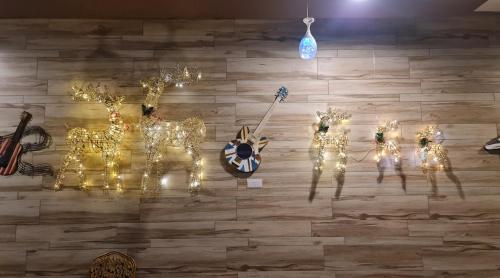 a wall with christmas lights on a wall at 888 Boutique Hotel in Batu Pahat