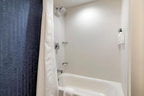 a bathroom with a tub and a toilet and a shower at Fairfield by Marriott Inn & Suites North Conway in North Conway