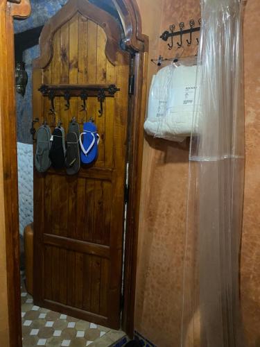 a door to a room with a room with a bed at Riad Azurite in Chefchaouene