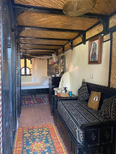 a bedroom with a bed in a room with a bed sqor at Riad Azurite in Chefchaouene
