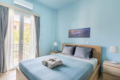 a bedroom with a bed with a toy car on it at Seaside escape apartment in Palaiá Fókaia