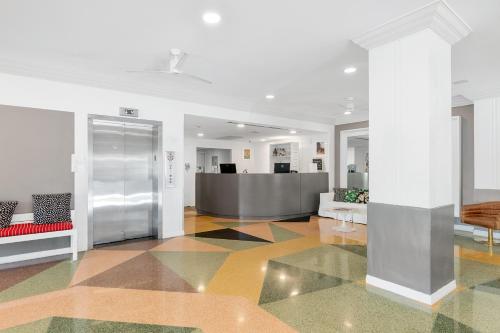 a living room with a lobby with a reception desk at Townhouse Hotel, BW Signature Collection in Miami Beach