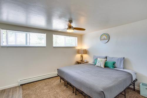 een slaapkamer met een bed en een plafondventilator bij Grand Junction Vacation Rental with Patio and Grill! in Grand Junction