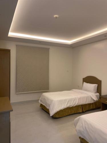 Llit o llits en una habitació de جوهرة العربية