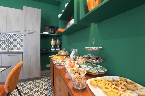 a table with many plates of food on it at Malù - Bed & Breakfast in Agrigento