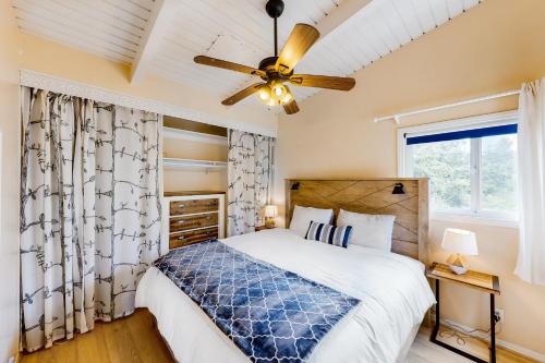 a bedroom with a bed and a ceiling fan at El Camino De La Luz Adventure in Santa Barbara