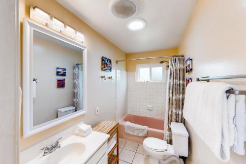 a bathroom with a sink and a toilet and a tub at El Camino De La Luz Adventure in Santa Barbara
