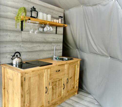 a kitchen with a sink in a room at Cambridgeshire Glamping in Fowlmere