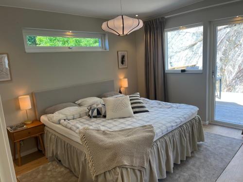 a bedroom with a large bed in a room at Luxury Modern Home near Gothenburg & 3 min t Beach in Billdal