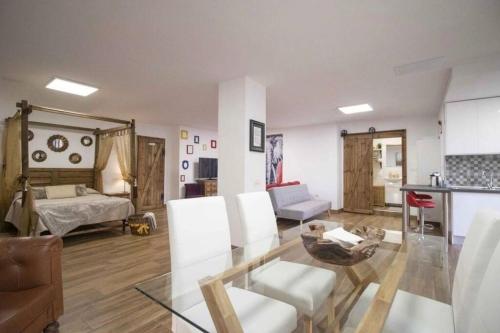 a living room with a bed and a table and chairs at Villa Canales in La Matanza de Acentejo