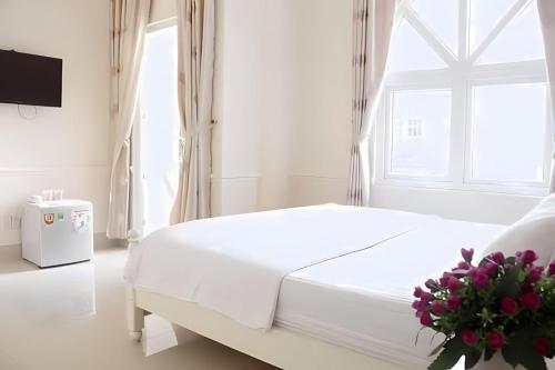 Postel nebo postele na pokoji v ubytování THIÊN ANH HOTEL