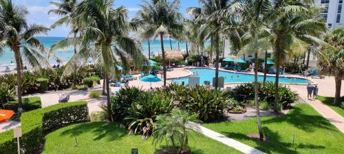 an aerial view of a resort with a pool and the ocean at NEW LUXURY APARTMENT 2Br 2Ba DIRECT BEACH ACCESS in Hollywood Beach