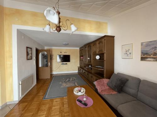 a living room with a couch and a table at Apartments Krnjic in Umag