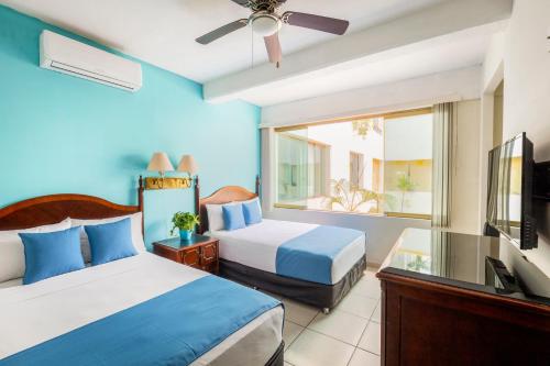 Letto o letti in una camera di Hotel Pueblito Vallarta