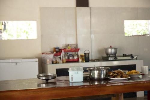 a kitchen with a counter with some food on it at La Jose Beach Resort in Pagudpud