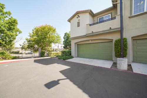 a driveway in front of a house with a garage at Modern Moreno Valley Oasis with Private Patio in Moreno Valley