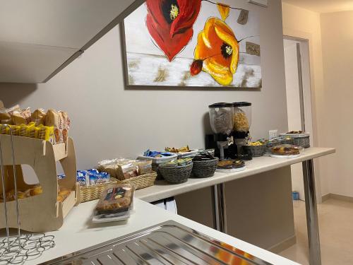 a kitchen with two counters with food on them at Vista al Tramonto B&B in Falerna