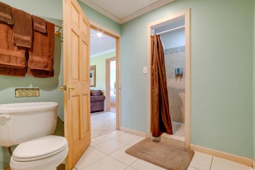 a bathroom with a toilet and a walk in shower at Lakeside Gem Hot Tub and Game Room in Hancock in Deposit