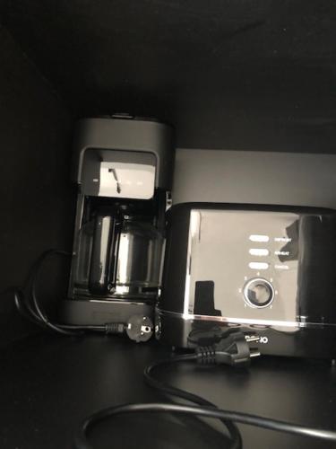 a coffee maker sitting on top of a counter at HELIOS in Knokke-Heist