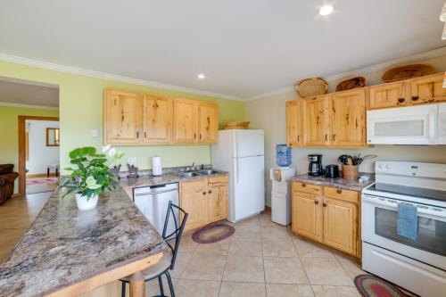 a kitchen with wooden cabinets and a counter top at Lakeside Gem Hot Tub and Game Room in Hancock in Deposit