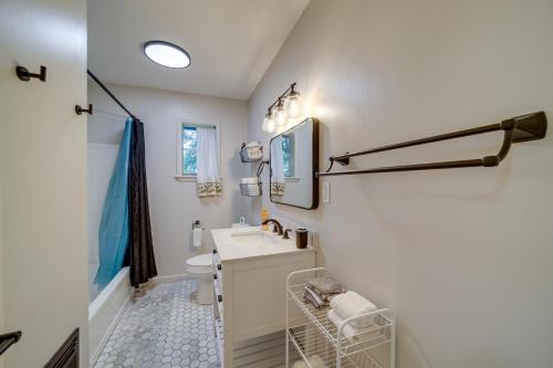 a bathroom with a sink and a toilet at Wagoner Vacation Rental Near Fort Gibson Lake! in Wagoner