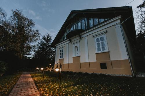a building with a dome on top of it at night at Villa Mimi in Sopron