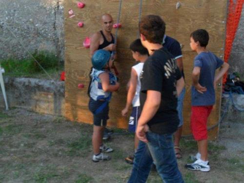a group of people standing in front of a climbing wall at Bed And Breakfasts LA CASETTA in Terranova di Pollino