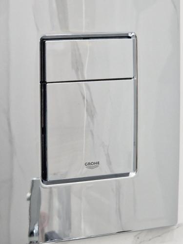 a chrome refrigerator door with a glass window at Expo Residence Astana in Astana