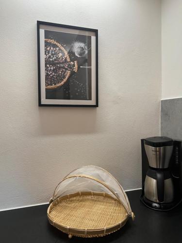 a picture hanging on a wall next to a coffee maker at Apartmán Elen 6 lůžek, 86 m2 in Děčín