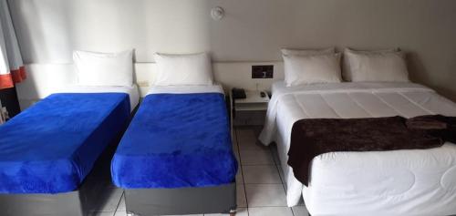 Hotel Gênova BCにあるベッド