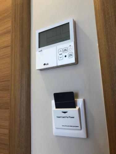 a microwave and a box on a wall at Grand İska Palace in Istanbul