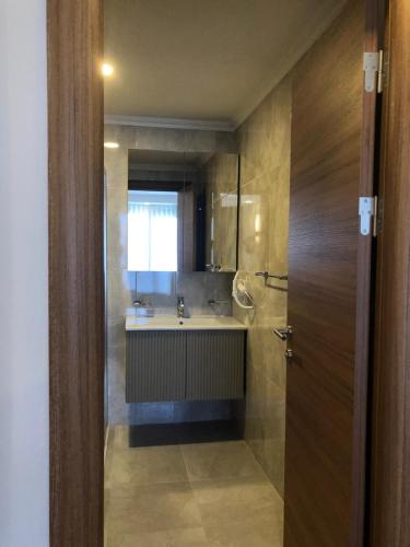 a bathroom with a sink and a mirror at Grand İska Palace in Istanbul