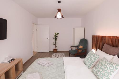 Katil atau katil-katil dalam bilik di Hannah's Apartment Ocna Mures