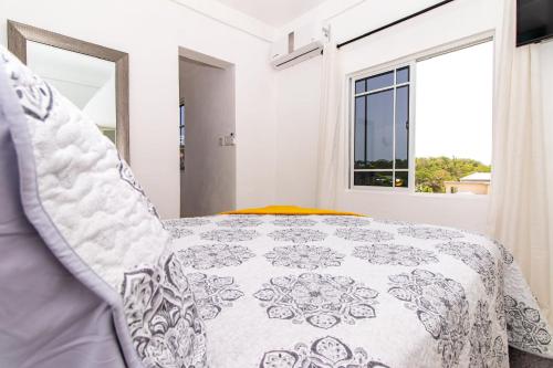 Ένα ή περισσότερα κρεβάτια σε δωμάτιο στο Runaway Bay Gem Suite