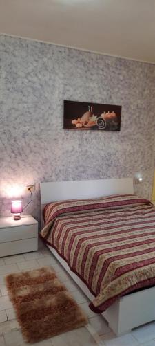 En eller flere senge i et værelse på Casa Vacanza Nonni Di Millo