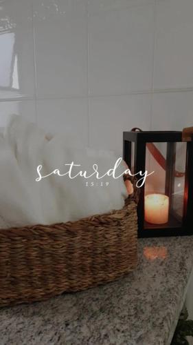 a basket of smoke next to a candle and a clock at Pousada Blumenau in Blumenau